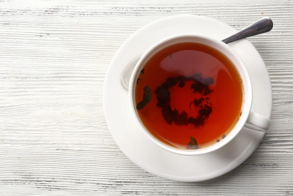 Cup of tea on white table — Stock Photo, Image