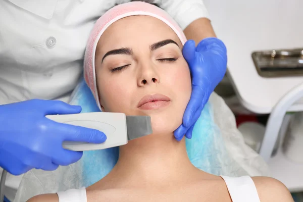 Young woman having face procedures — Stock Photo, Image