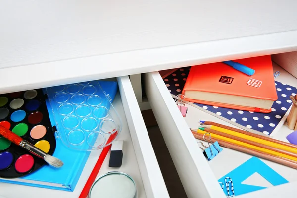 Stationery in open desk drawer — Stock Photo, Image