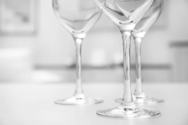 Wineglasses on blurred interior — Stock Photo, Image