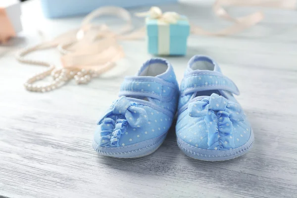 Beautiful composition with baby booties — Stock Photo, Image