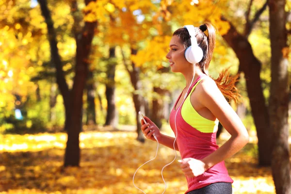 Young beautiful woman running — Stock Photo, Image