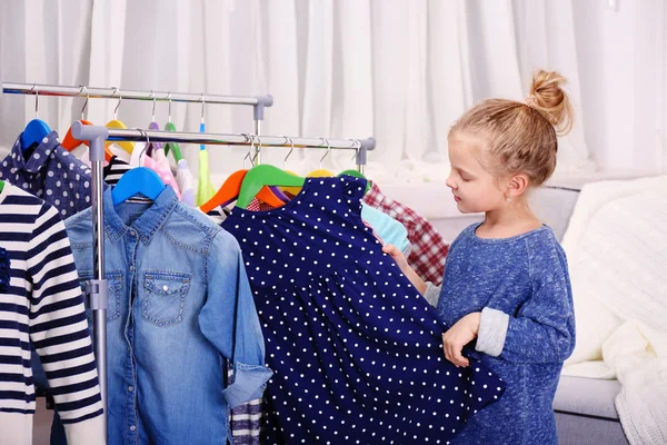 Little girl trying dress — Stock Photo, Image