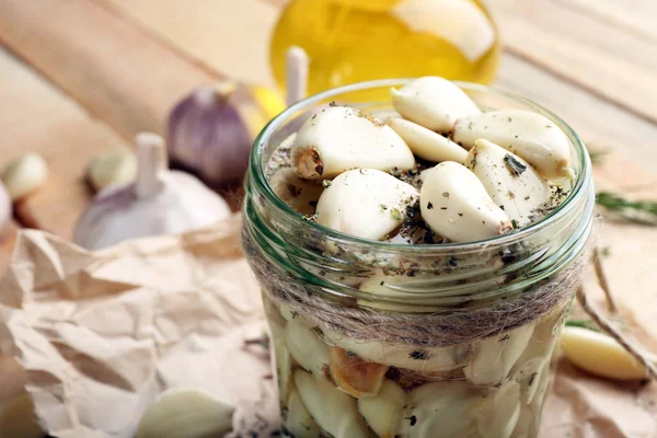 Garlic with spices on table — Stock Photo, Image