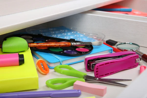 Stationery in open desk drawer — Stock Photo, Image