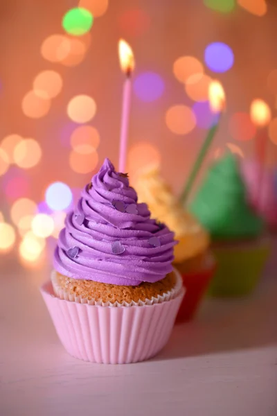 Cupcake with purple cream — Stock Photo, Image