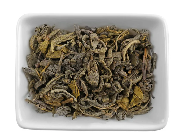 Сухе листя чаю в мисці — стокове фото
