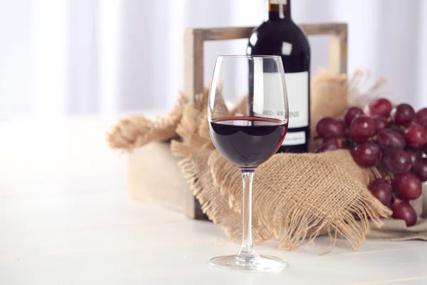 Glass and bottle of red wine — Stock Photo, Image