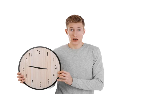Handsome young man holding clock — Stock Photo, Image