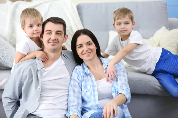 Happy Family Sitting Floor Couch Background Closeup — Stock Photo, Image