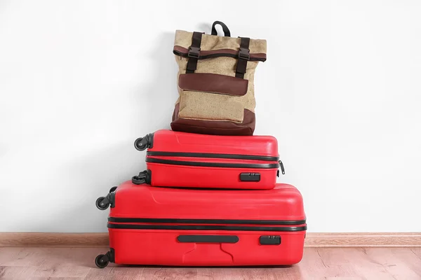 Different suitcases standing on floor — Stock Photo, Image