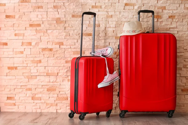 Different suitcases standing on floor — Stock Photo, Image