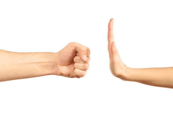 Woman hand stopping angry man fist — Stock Photo, Image