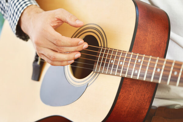 Man playing acoustic guitar