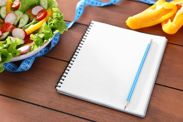 Notebook on wooden table — Stock Photo, Image