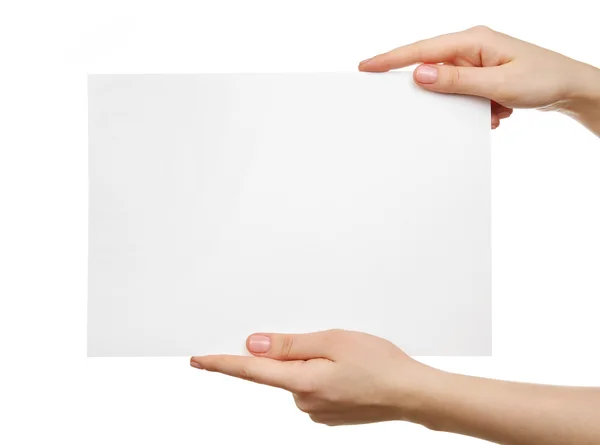 Female hands holding blank sheet — Stock Photo, Image