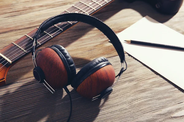 Headphones and notebook   on  background — Stock Photo, Image