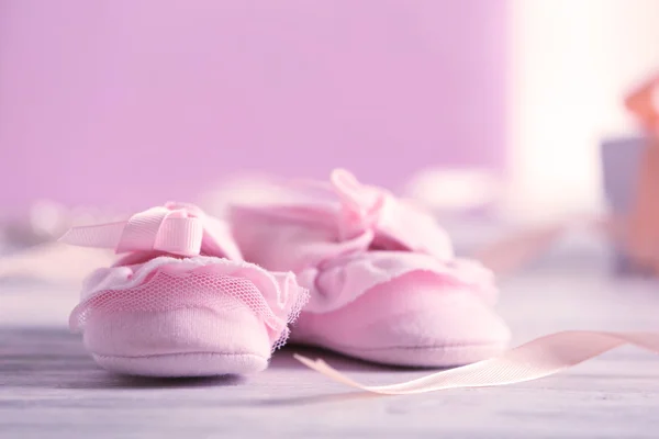 Beautiful composition with baby booties — Stock Photo, Image