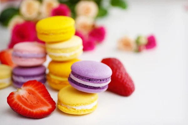 Macaroons with roses and strawberries