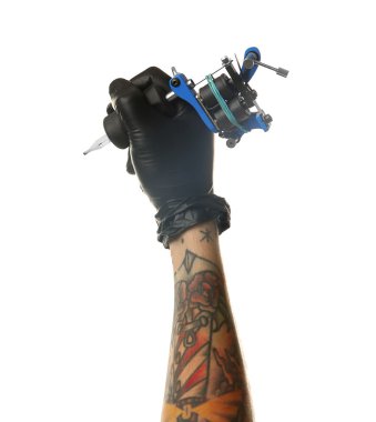 Man's hand holding tattoo machine  clipart