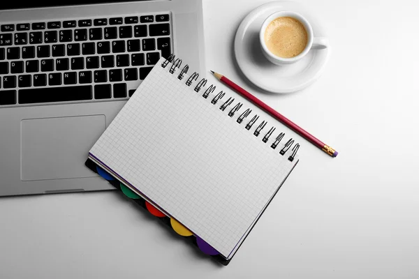 Empty  notebook on laptop keyboard — Stock Photo, Image