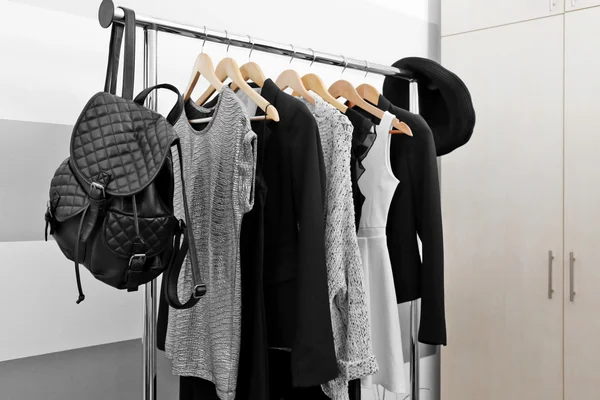 Clothes on hangers in a room — Stock Photo, Image