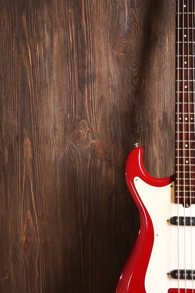 Electric guitar on wooden background — Stock Photo, Image