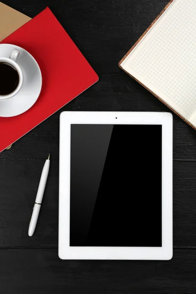 Digital tablet with cup of coffee and notebook — Stock Photo, Image