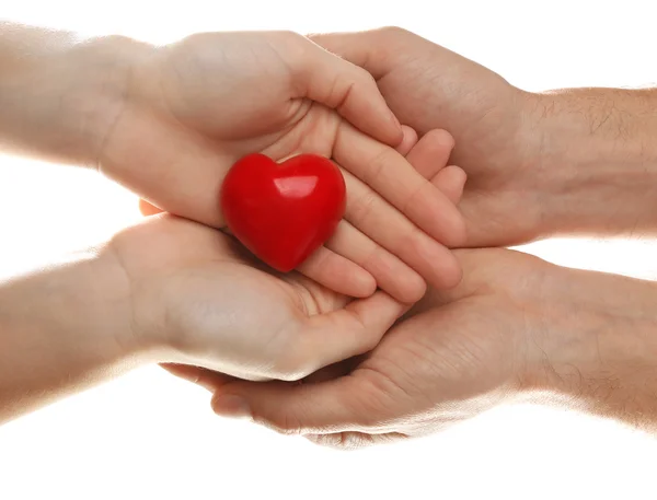 Decorative heart in female and male hands — Stock Photo, Image