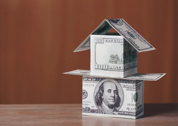 Money house on wooden table — Stock Photo, Image