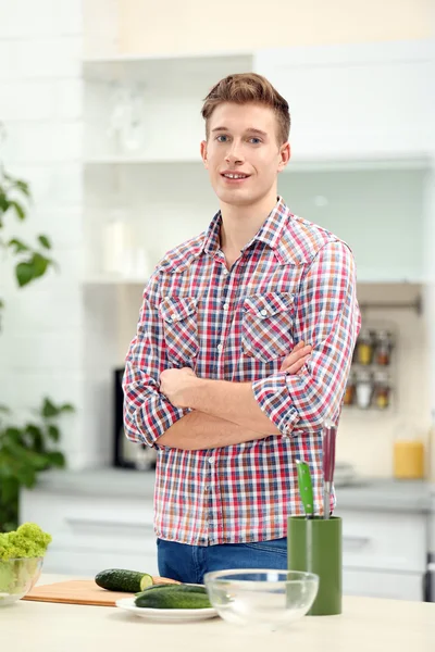 Handsome man in bright kitchen — Stock Photo, Image
