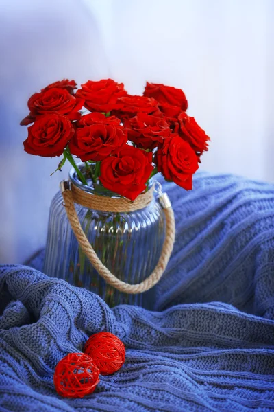 Glass jar of red roses — Stock Photo, Image