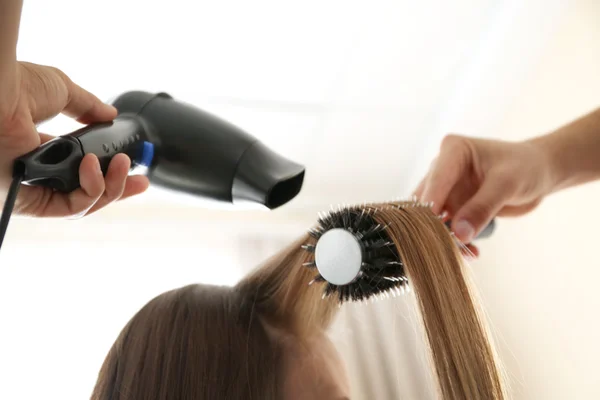 Hairdresser drying hair — Stock Photo, Image