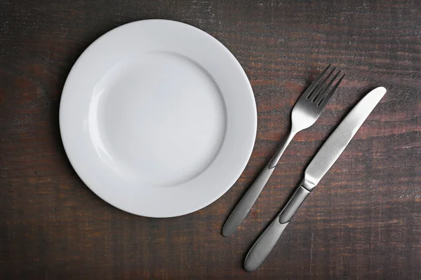 Empty plate with silver cutlery — Stock Photo, Image