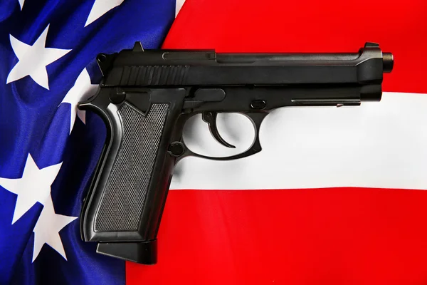 Gun on USA flag — Stock Photo, Image