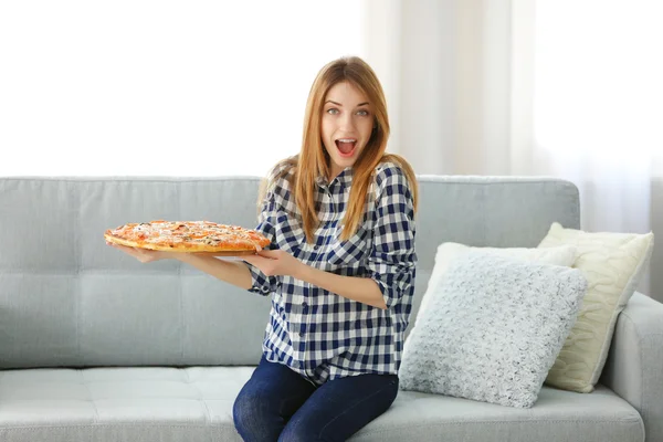 Woman holding slice of hot pizza — Stock Photo, Image