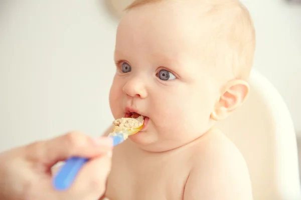 Baby boy eating — Stock Photo, Image