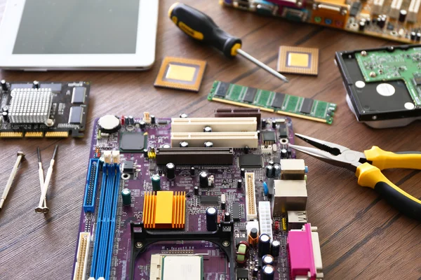 Electronic circuits on wooden table — Stock Photo, Image