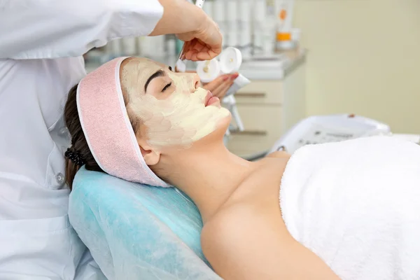 Young woman having face procedures — Stock Photo, Image