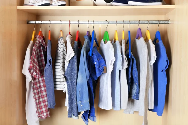 Boy clothes on hangers. — Stock Photo, Image