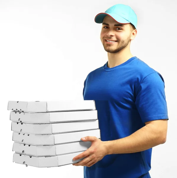 Young man holding pizza — Stock Photo, Image