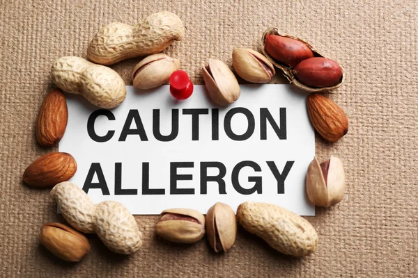 Sign CAUTION ALLERGY with nuts — Stock Photo, Image