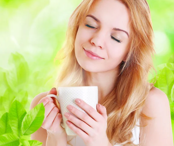 girl enjoying cup of tea