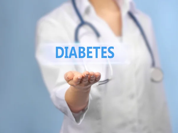 Young female doctor with text diabetes — Stock Photo, Image