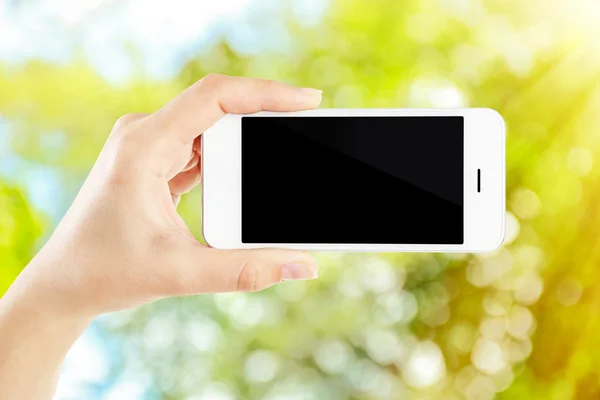 Hand shows mobile smart phone — Stock Photo, Image