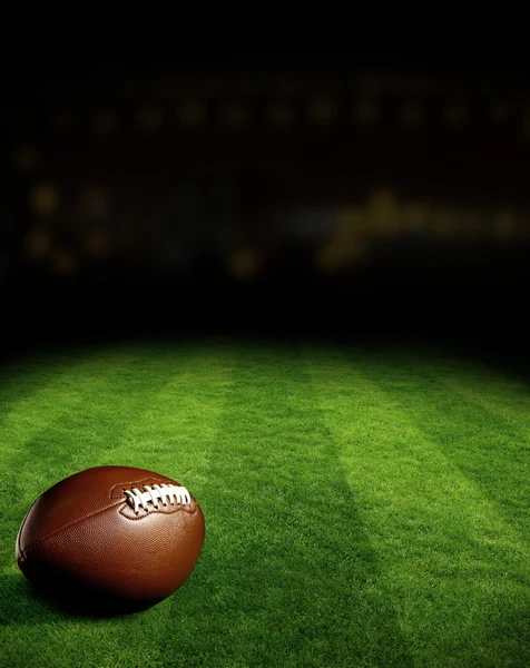 American football on green field — Stock Photo, Image