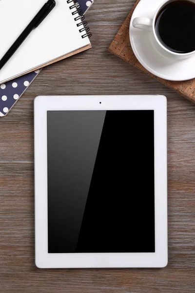 Tablet with cup of coffee and notepad — Stock Photo, Image