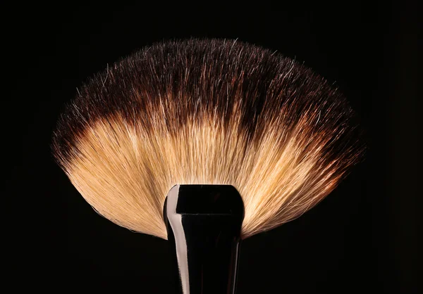 Makeup brush on black — Stock Photo, Image