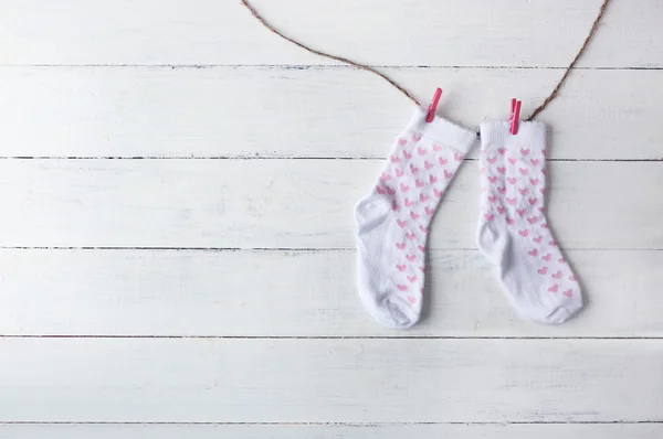 Baby socks hanging — Stock Photo, Image