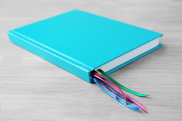 Notebook with bookmarks on  table — Stock Photo, Image